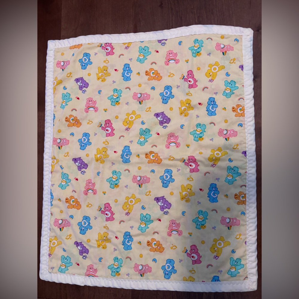 Care Bear Throw 24x20. Front side is cotton. Reverse side is soft fleece like